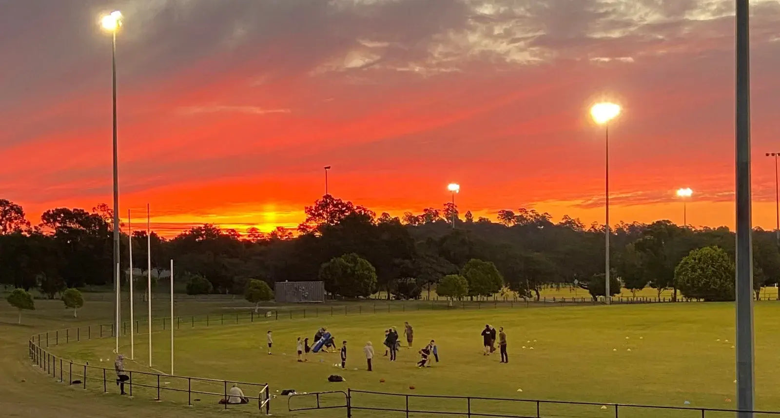 kids at an AFL park at dusk